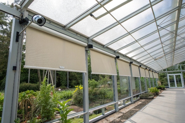 External shade cloth system on greenhouse