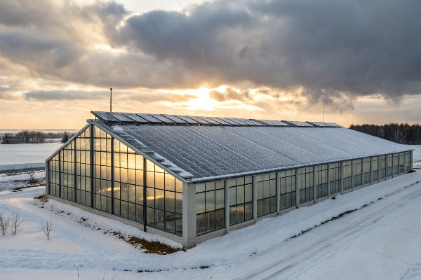 Diagram showing passive solar heating principles in greenhouse