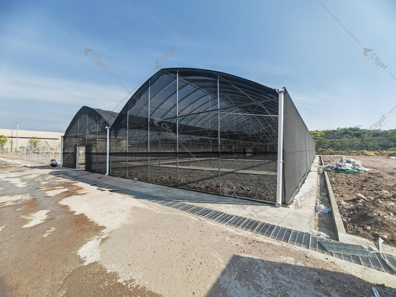 Single dark-clad greenhouse exterior with architectural front view. Good for product catalog and structure-type cards. product-style greenhouse or hydroponic visual for greenhouse wind load snow load