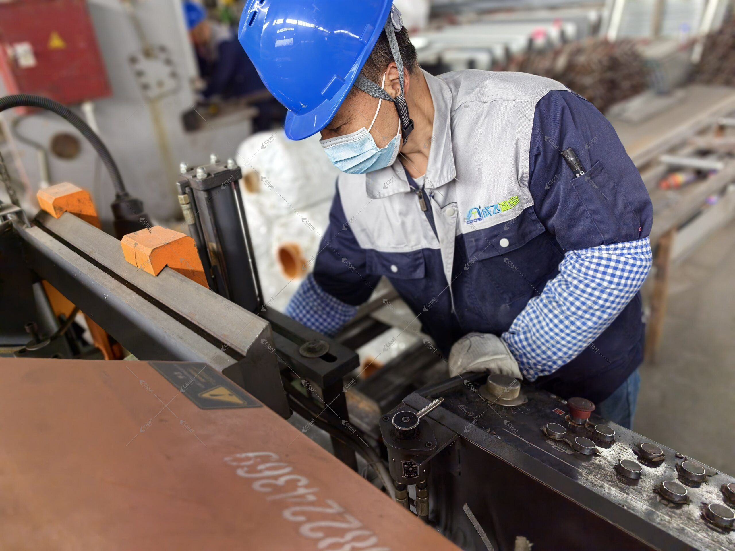 CFGET factory technician fabricating a greenhouse steel component