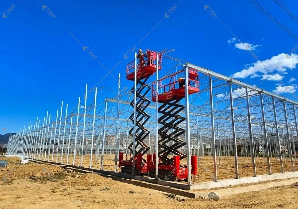 Connection inspection requires safe access and located evidence. Record missing fasteners, slipped clamps, brace slack, weld defects, movement, deformation, and coating damage by bay and component. Mobile lifting platforms providing access to greenhouse frame connections during installation